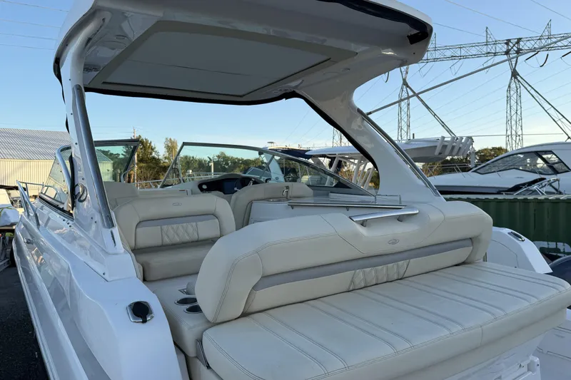  Yacht Photos Pics 2019 Regal 33 OBX boat with luxurious seating and sleek design in a marina setting.