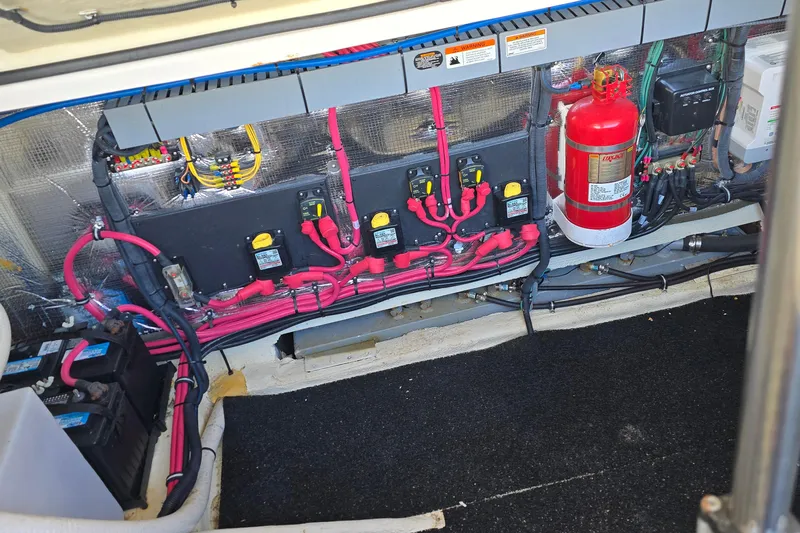  Yacht Photos Pics 2019 Regal 33 OBX engine compartment with wiring, fire extinguisher, and battery setup.