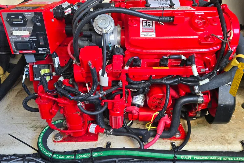  Yacht Photos Pics Red engine of a 2019 Regal 33 OBX boat, featuring EFI system and wiring.