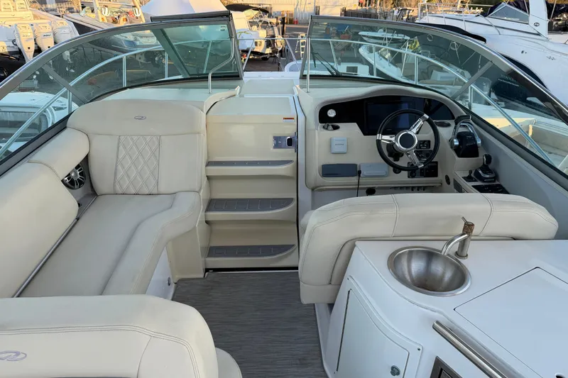 Yacht Photos Pics 2019 Regal 33 OBX boat interior with luxurious seating and modern helm.