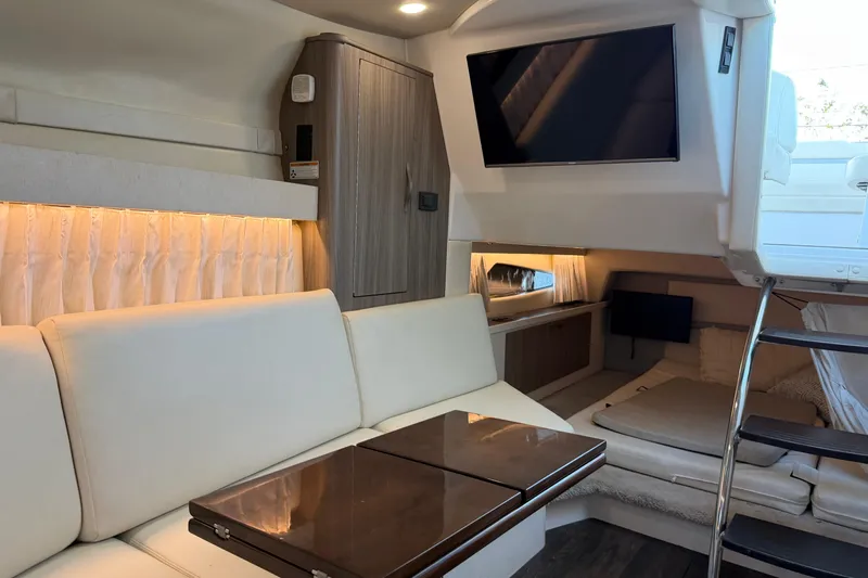  Yacht Photos Pics Luxurious interior of 2019 Regal 33 OBX boat with modern seating and entertainment system.
