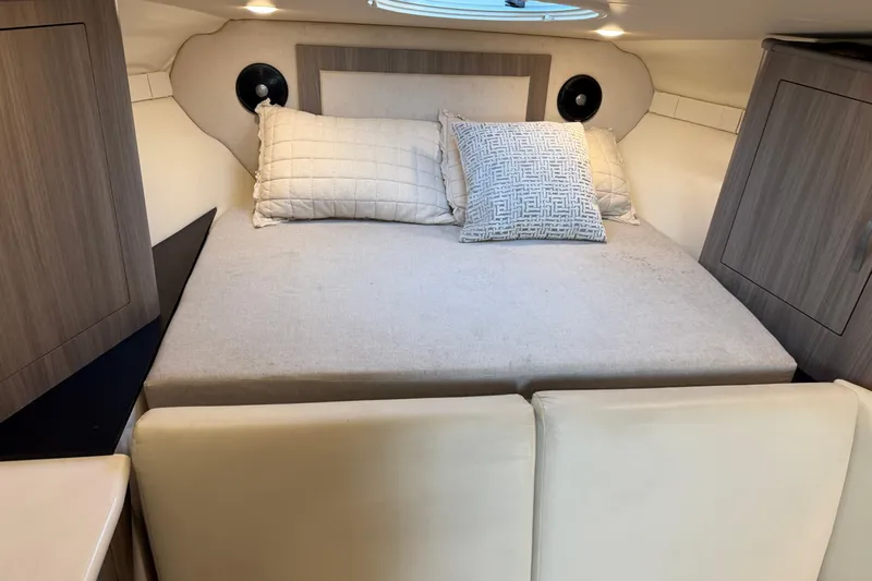 Yacht Photos Pics 2019 Regal 33 OBX cabin interior with cozy bed and modern design.