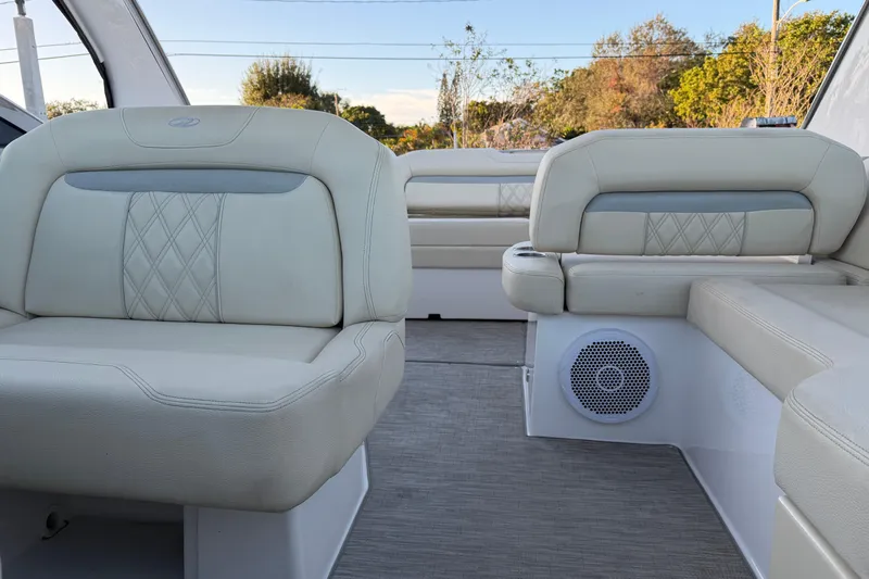  Yacht Photos Pics Luxurious interior seating of 2019 Regal 33 OBX boat with elegant upholstery design.