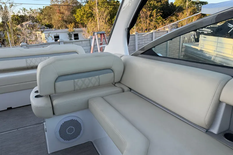  Yacht Photos Pics 2019 Regal 33 OBX boat interior with beige seating and speaker.