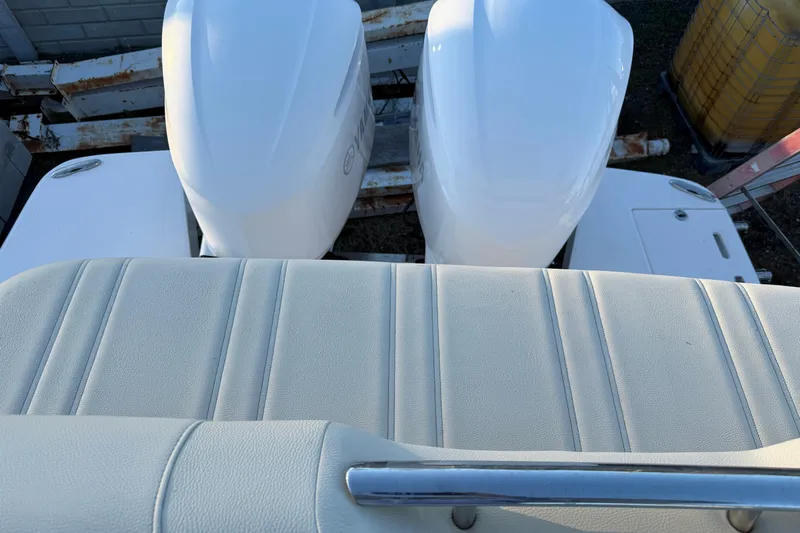  Yacht Photos Pics 2019 Regal 33 OBX boat with dual outboard engines and cushioned seating.