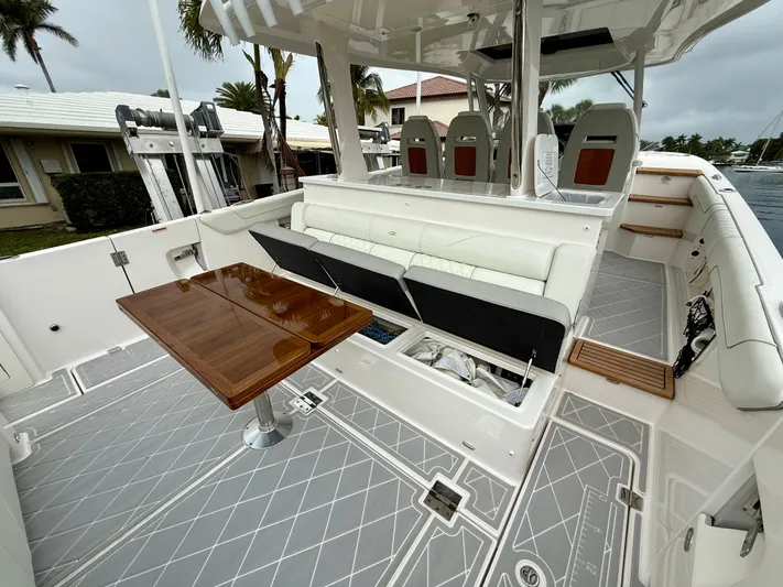 Yacht Photos Pics 2021 Regal 38 SAV boat interior with seating, table, and modern design.