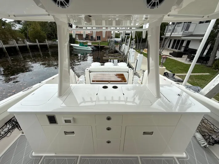  Yacht Photos Pics 2021 Regal 38 SAV boat interior with sleek white cabinetry and waterfront view.