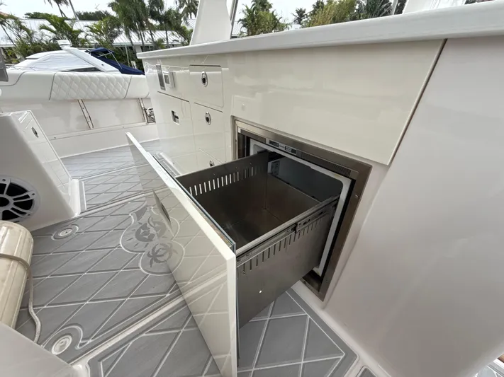  Yacht Photos Pics 2021 Regal 38 SAV boat interior with open storage compartment and sleek design.