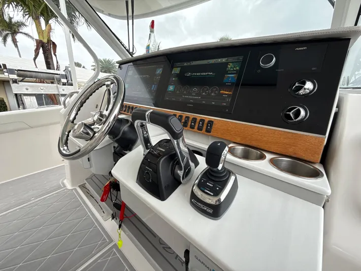  Yacht Photos Pics 2021 Regal 38 SAV boat helm with modern controls and touchscreen display.