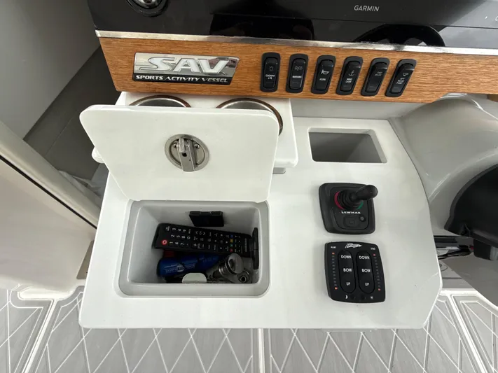  Yacht Photos Pics 2021 Regal 38 SAV control panel with storage compartment and electronic controls.