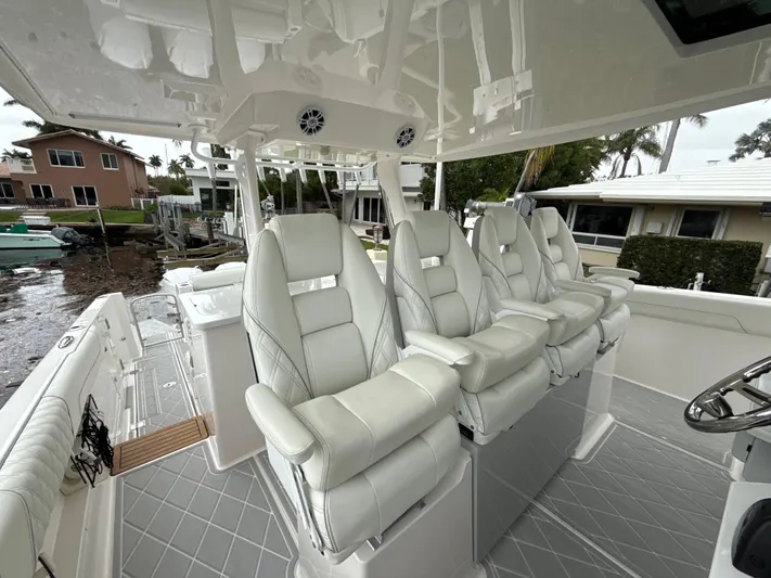  Yacht Photos Pics 2021 Regal 38 SAV boat with luxurious white seating and modern design.