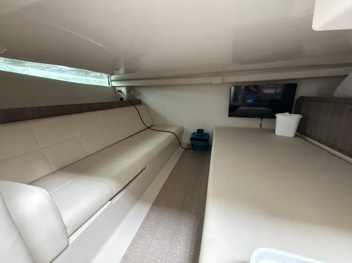  Yacht Photos Pics Interior of 2021 Regal 38 SAV yacht with seating and TV.