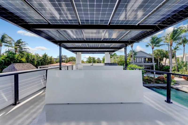  Yacht Photos Pics Rooftop view of 2024 ARKUP 50 Liveable Yacht with solar panels and tropical surroundings.