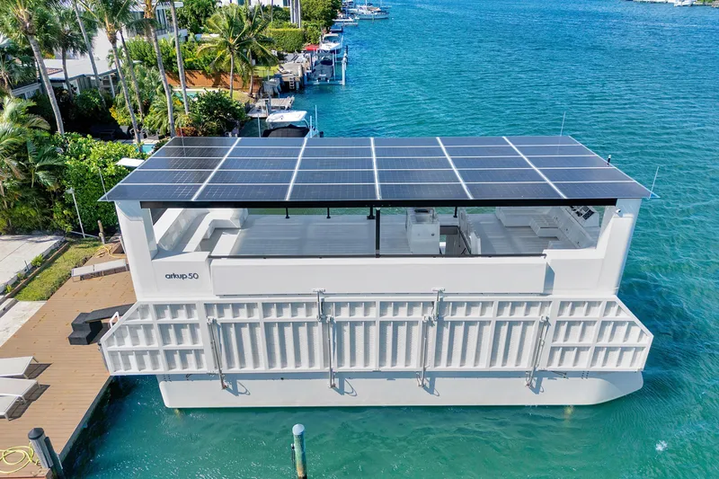  Yacht Photos Pics 2024 ARKUP 50 Liveable Yacht with solar panels docked in a tropical marina.
