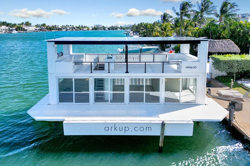  Yacht Photos Pics 2024 ARKUP 50 Liveable Yacht on water, featuring modern design and solar panels.