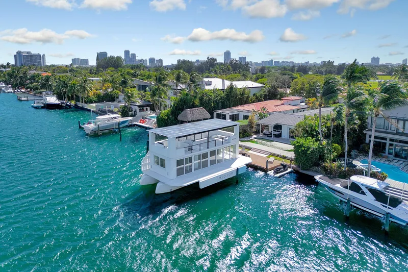  Yacht Photos Pics Floating ARKUP 50 Liveable Yacht, 2024 model, docked in a scenic waterfront neighborhood.