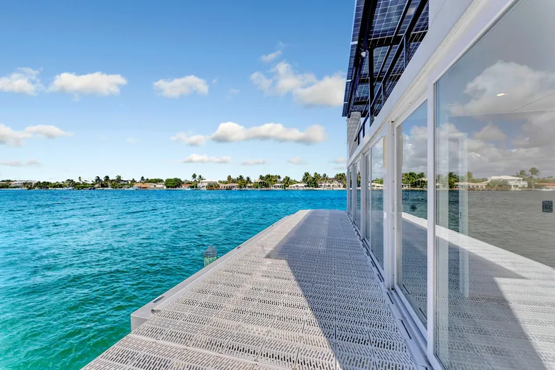  Yacht Photos Pics Modern ARKUP 50 Liveable Yacht with solar panels, overlooking serene blue waters, 2024 model.