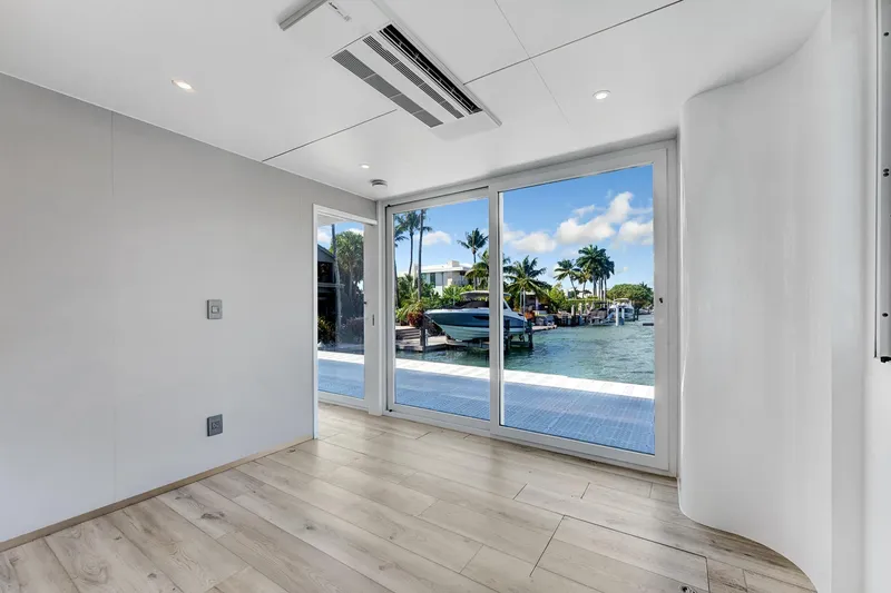  Yacht Photos Pics Modern interior of 2024 ARKUP 50 Liveable Yacht with waterfront view.