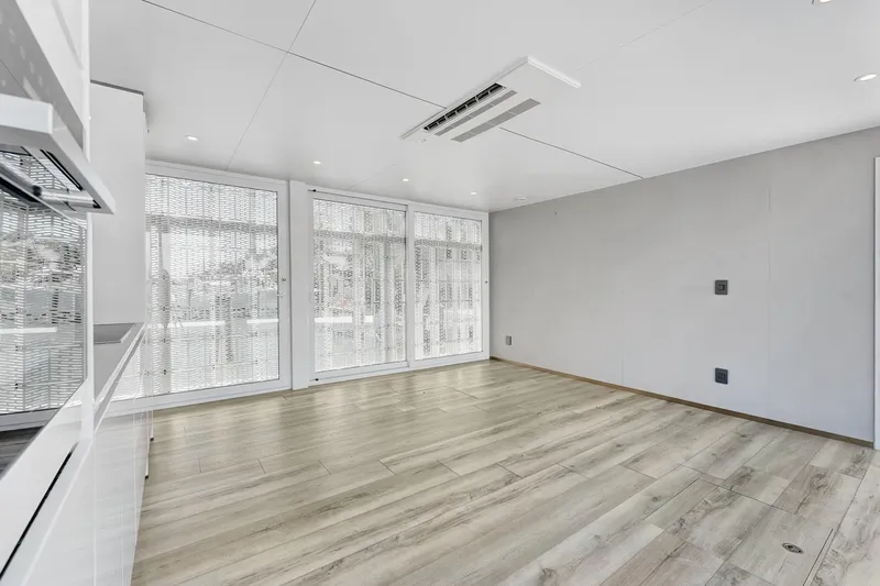  Yacht Photos Pics Modern interior of 2024 ARKUP 50 Liveable Yacht with large windows and wooden flooring.