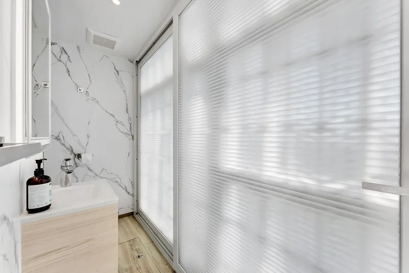  Yacht Photos Pics Modern bathroom interior on 2024 ARKUP 50 Liveable Yacht with marble walls and sleek design.