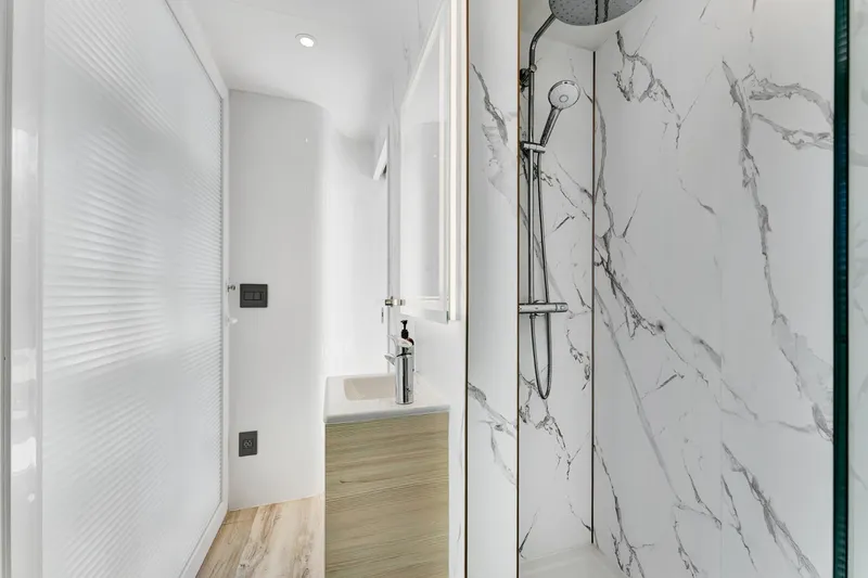  Yacht Photos Pics Modern bathroom in 2024 ARKUP 50 Liveable Yacht with marble shower and sleek design.