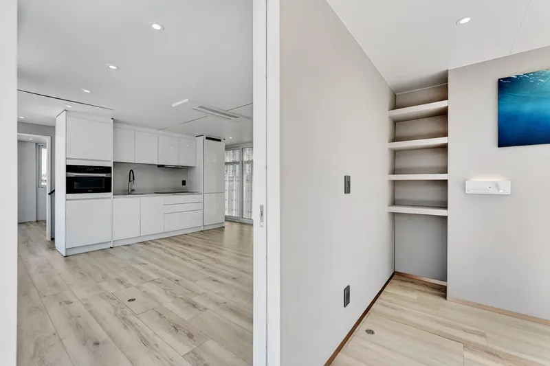  Yacht Photos Pics Modern kitchen interior of 2024 ARKUP 50 Liveable Yacht with sleek white cabinetry.