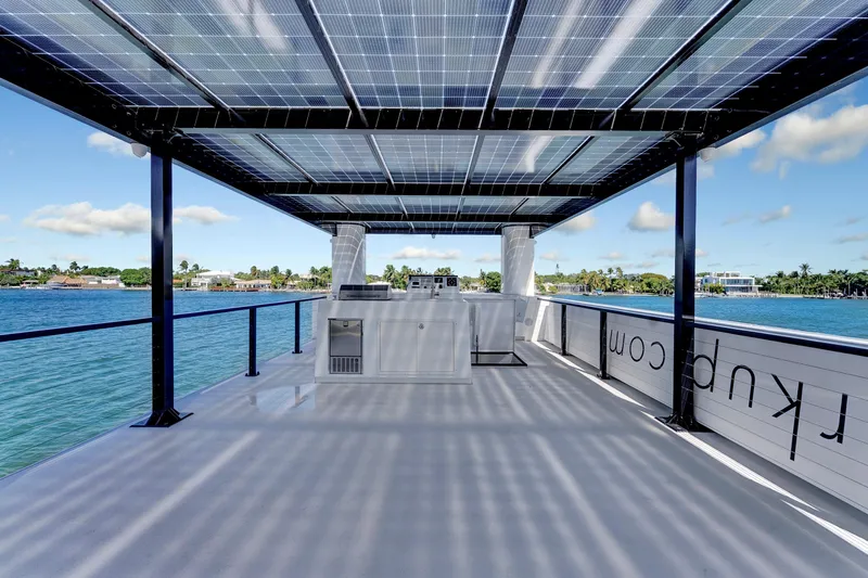  Yacht Photos Pics 2024 ARKUP 50 Liveable Yacht with solar panels, spacious deck, and waterfront view.