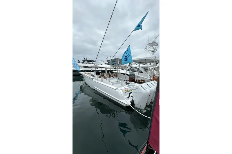  Yacht Photos Pics 2024 Mag Bay 43 CC boat docked, featuring sleek design and powerful engines.