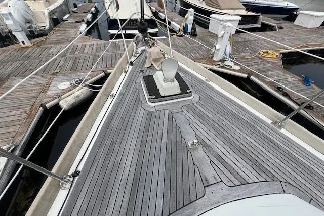 September Morn Yacht Photos Pics 1986 Little Harbor AFt Cockpit K/CB Sloop docked, showcasing teak deck and marina surroundings.