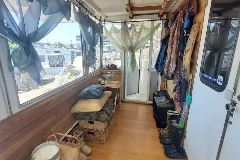 Elizabeth Yacht Photos Pics 1989 DeFever 57 POC Motor Yacht interior with wooden decor and nautical accessories.