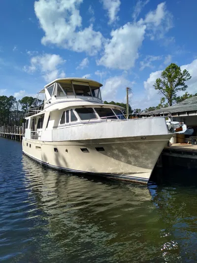 Elizabeth Yacht Photos Pics 1989 DeFever 57 POC Motor Yacht docked under a clear blue sky.