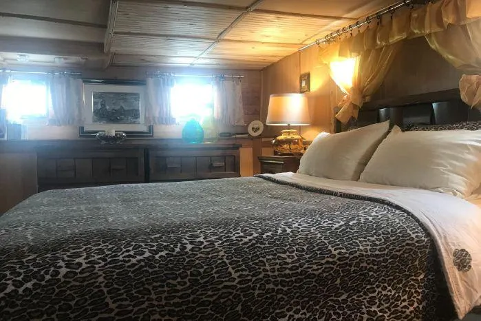 Elizabeth Yacht Photos Pics Luxurious bedroom interior of 1989 DeFever 57 POC Motor Yacht with elegant decor.