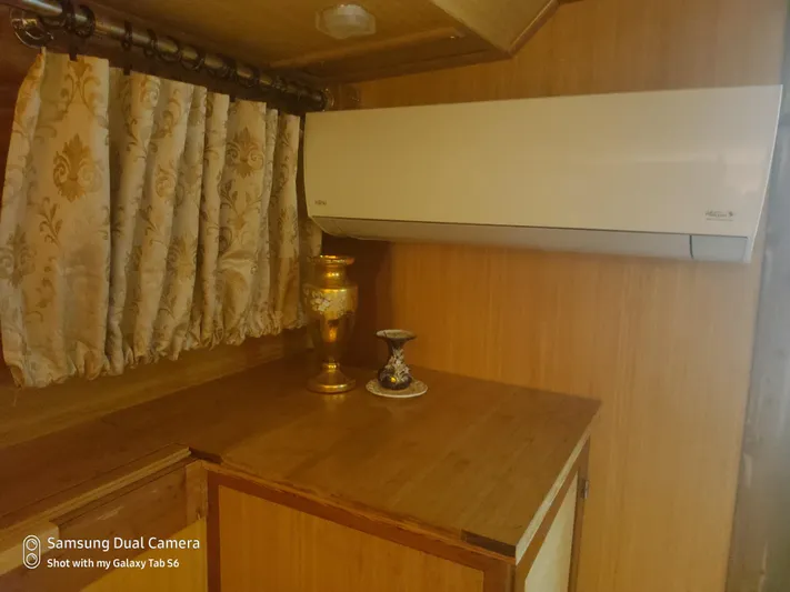 Elizabeth Yacht Photos Pics Interior of 1989 DeFever 57 POC Motor Yacht with air conditioner and decorative vase.