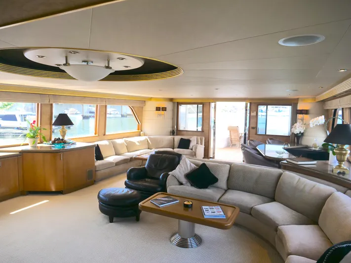 Cwelebration Yacht Photos Pics Luxurious interior of 2000 Westport 112 yacht with elegant seating and large windows.