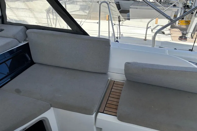  Yacht Photos Pics 2019 Beneteau Oceanis 51.1 yacht cockpit with gray cushioned seating.