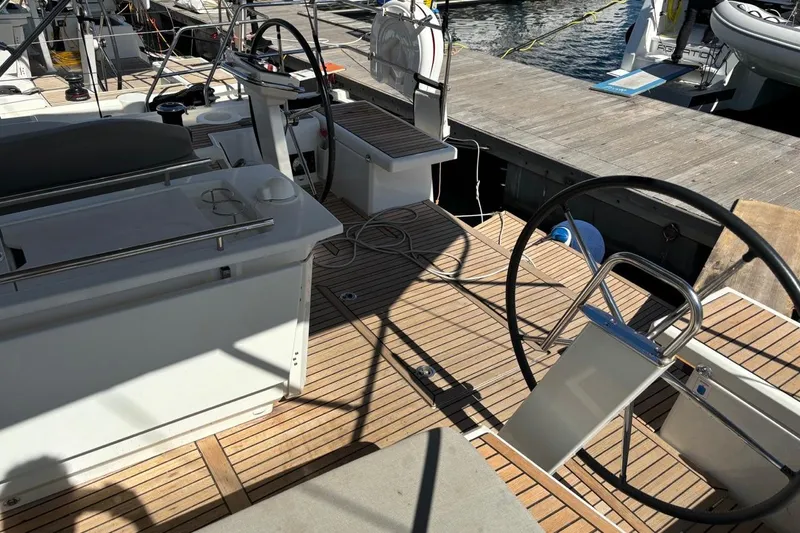  Yacht Photos Pics Cockpit of 2019 Beneteau Oceanis 51.1 yacht with dual steering wheels and teak decking.