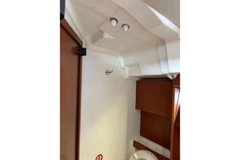 Yacht Photos Pics Interior of 2019 Beneteau Oceanis 51.1 yacht, featuring wooden cabinetry and modern design.