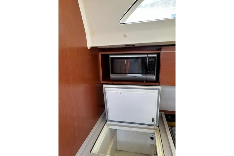  Yacht Photos Pics Galley of 2019 Beneteau Oceanis 51.1 with microwave and open storage compartment.