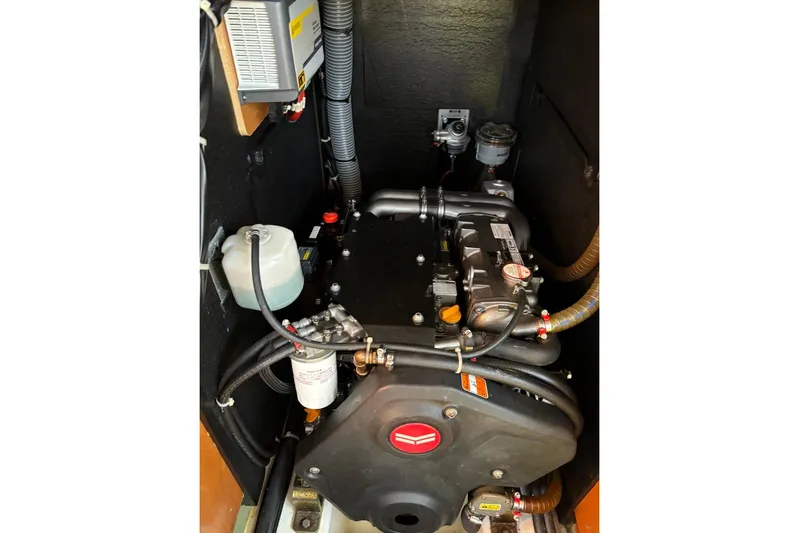  Yacht Photos Pics Engine compartment of a 2019 Beneteau Oceanis 51.1 sailboat, showcasing mechanical components.