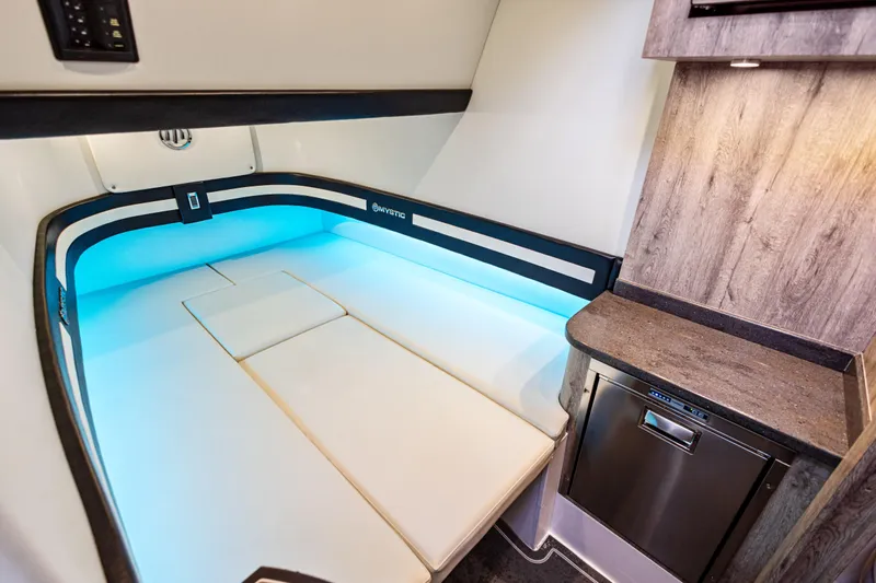  Yacht Photos Pics 2026 Mystic Powerboats M4200 cabin interior with modern design and ambient lighting.