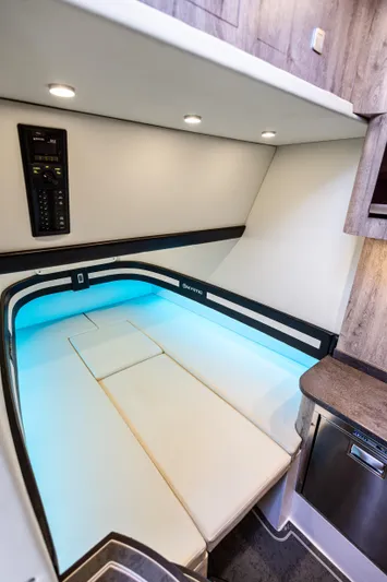  Yacht Photos Pics 2026 Mystic Powerboats M4200 cabin interior with modern lighting and sleek design.