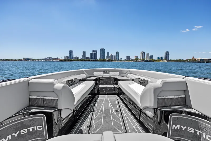  Yacht Photos Pics 2026 Mystic Powerboats M4200 interior with city skyline and water view.