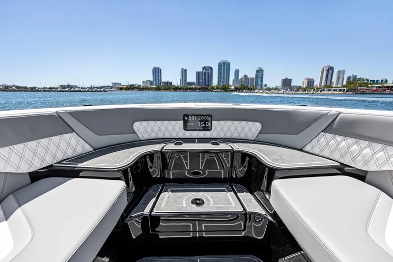  Yacht Photos Pics 2026 Mystic Powerboats M4200 interior with city skyline view, luxurious seating, and modern design.