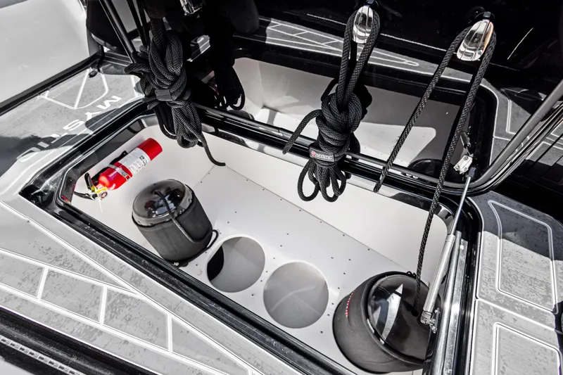  Yacht Photos Pics Storage compartment of 2026 Mystic Powerboats M4200 with ropes and fire extinguisher.