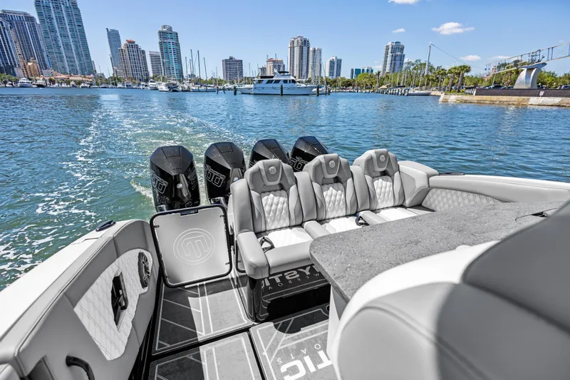  Yacht Photos Pics 2026 Mystic Powerboats M4200 luxury boat interior with city skyline in background.