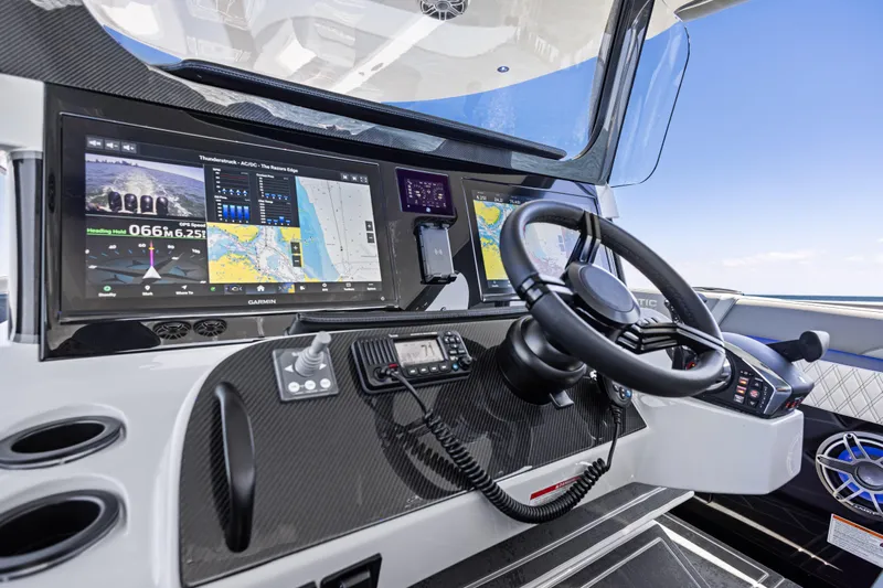  Yacht Photos Pics Cockpit of 2026 Mystic Powerboats M4200 with advanced navigation displays and steering wheel.