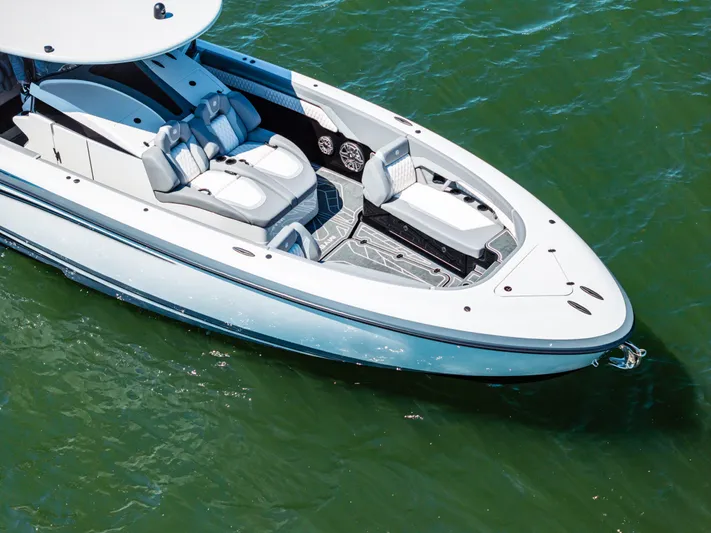  Yacht Photos Pics 2026 Mystic Powerboats M4200 on water, showcasing sleek design and luxurious seating.