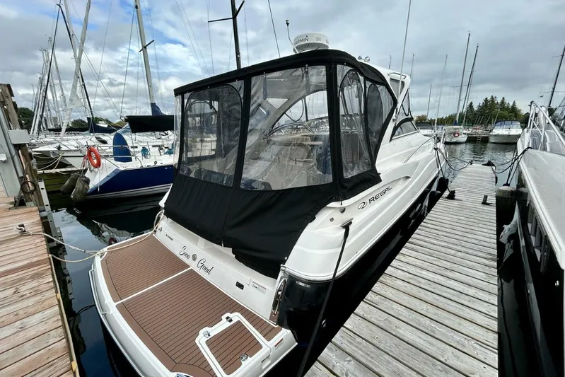  Yacht Photos Pics 2011 Regal 38 Express yacht docked at marina, featuring sleek design and covered cockpit.