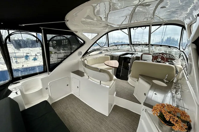  Yacht Photos Pics Interior of 2011 Regal 38 Express yacht with seating and helm, docked at marina.