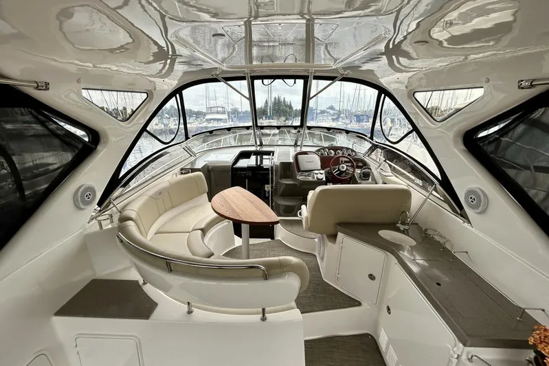  Yacht Photos Pics Luxurious interior of 2011 Regal 38 Express yacht with elegant seating and helm.